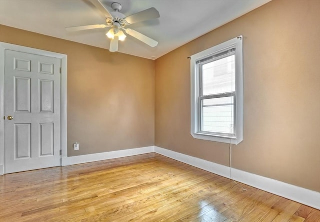 10 Windom St, Boston, MA 02134 - unfurnished room featuring light wood-style floors, baseboards, and a ceiling fan