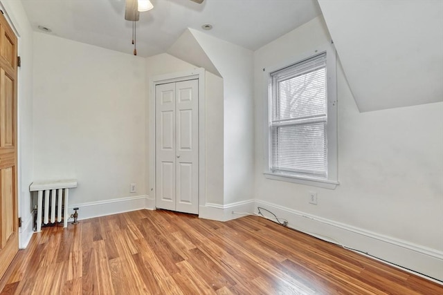 10 Windom St, Boston, MA 02134 - bonus room featuring radiator heating unit, light wood finished floors, ceiling fan, and vaulted ceiling