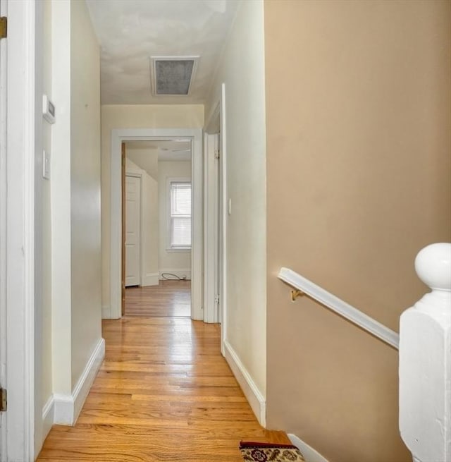10 Windom St, Boston, MA 02134 - hallway with light wood-type flooring, an upstairs landing, baseboards, and visible vents
