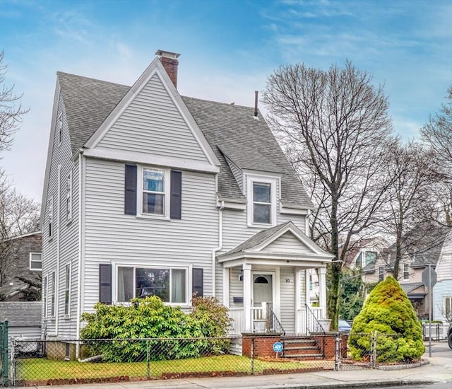 10 Windom St, Boston, MA 02134 - victorian house featuring a fenced front yard, a shingled roof, a gate, and a chimney