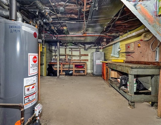 10 Windom St, Boston, MA 02134 - unfinished basement with gas water heater, a workshop area, and water heater