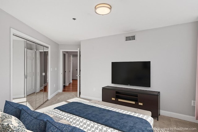 carpeted bedroom with a closet