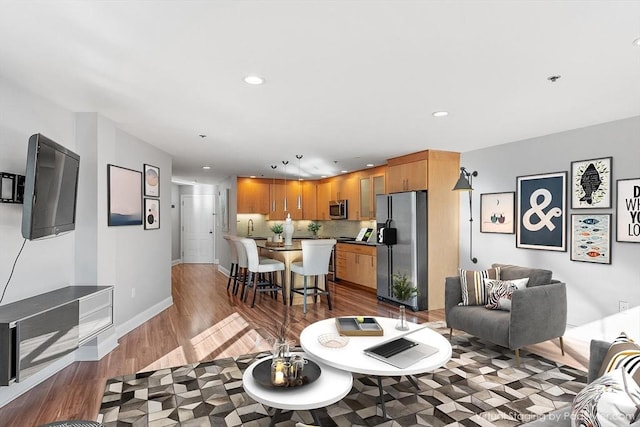 living room with dark hardwood / wood-style flooring