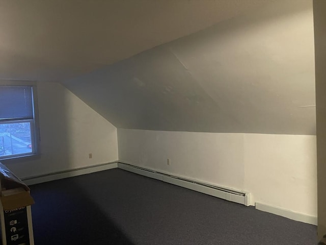 bonus room with a baseboard radiator and lofted ceiling