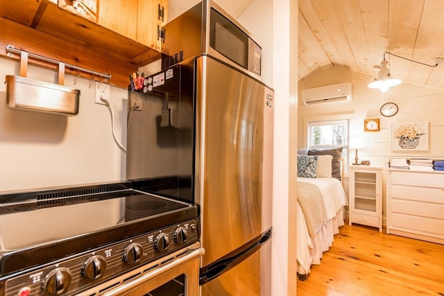 319 S Orleans Rd Unit 6, Orleans, MA 02653 - interior space with light wood-style floors, an AC wall unit, stove, wooden ceiling, and vaulted ceiling