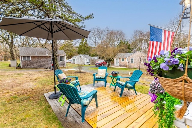 319 S Orleans Rd Unit 6, Orleans, MA 02653 - deck featuring a yard and an outdoor structure