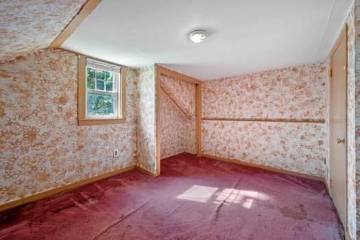 bonus room with vaulted ceiling