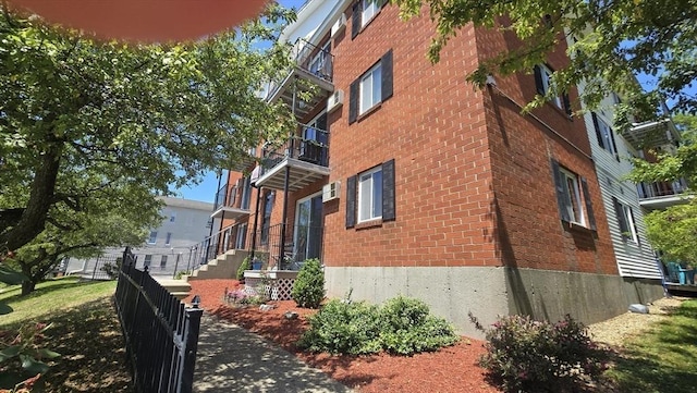 56 Edgeworth St Unit 14, Worcester, MA 01605 - view of side of property featuring brick siding and a balcony