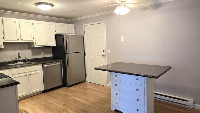56 Edgeworth St Unit 14, Worcester, MA 01605 - kitchen with a baseboard radiator, stainless steel appliances, dark countertops, crown molding, and a ceiling fan