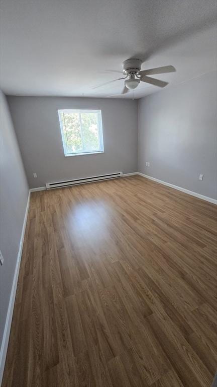 56 Edgeworth St Unit 14, Worcester, MA 01605 - unfurnished room featuring baseboard heating, wood finished floors, and ceiling fan