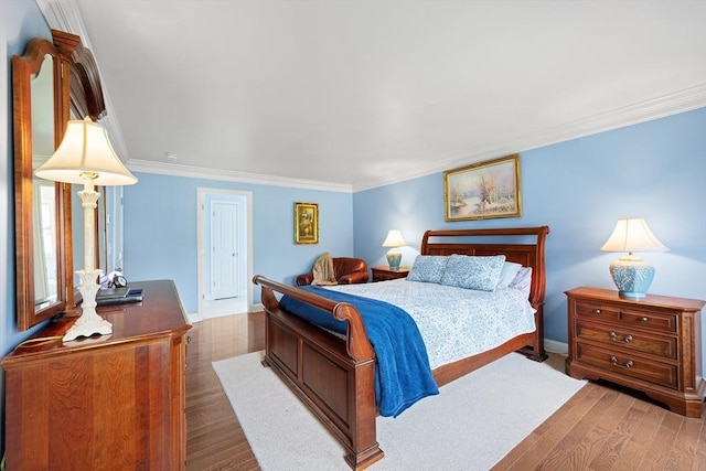 172 Orchard St, Newbury, MA 01922 - bedroom with wood finished floors, ornamental molding, and baseboards
