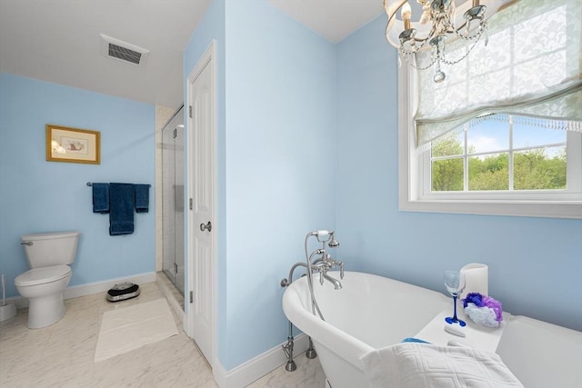 172 Orchard St, Newbury, MA 01922 - bathroom with a chandelier, toilet, a freestanding bath, a shower stall, and baseboards