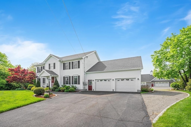 172 Orchard St, Newbury, MA 01922 - view of front facade featuring a garage, driveway, and a front yard