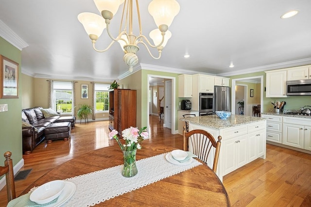 172 Orchard St, Newbury, MA 01922 - dining space featuring a chandelier, ornamental molding, light wood finished floors, baseboards, and recessed lighting