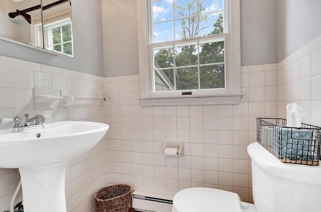10 Emile Cir, Medford, MA 02155 - half bath featuring tile walls, toilet, a baseboard radiator, and wainscoting