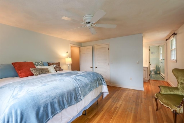 10 Emile Cir, Medford, MA 02155 - bedroom featuring light wood-type flooring, baseboards, ceiling fan, and connected bathroom