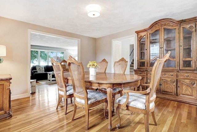 10 Emile Cir, Medford, MA 02155 - dining room featuring light wood-type flooring, stairway, and baseboards