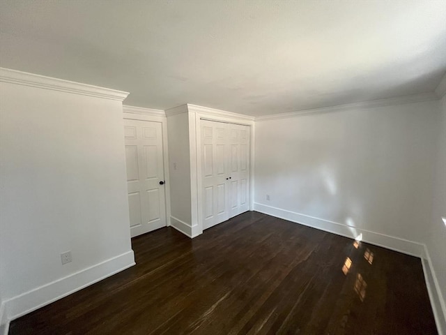 512 Lincoln St, Duxbury, MA 02332 - unfurnished bedroom featuring dark wood-style floors, a closet, and ornamental molding