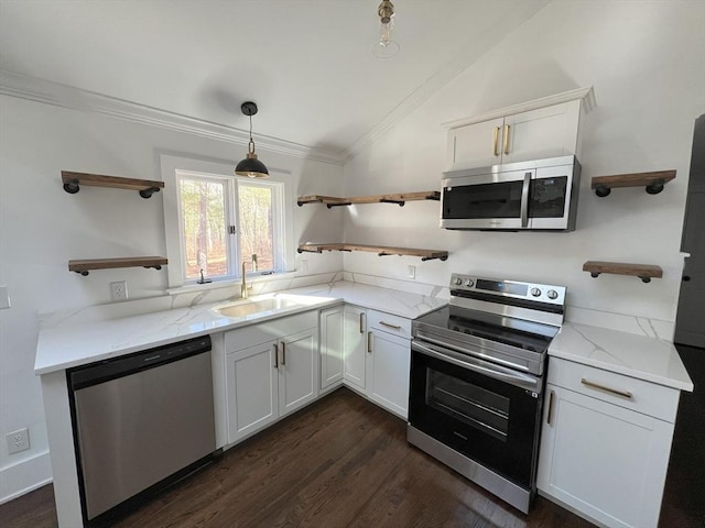 512 Lincoln St, Duxbury, MA 02332 - kitchen with open shelves, stainless steel appliances, vaulted ceiling, ornamental molding, and white cabinetry