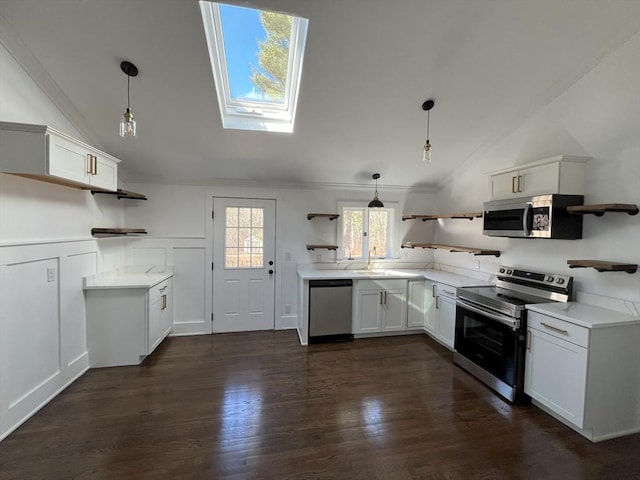 512 Lincoln St, Duxbury, MA 02332 - kitchen featuring open shelves, appliances with stainless steel finishes, vaulted ceiling, a skylight, and pendant lighting