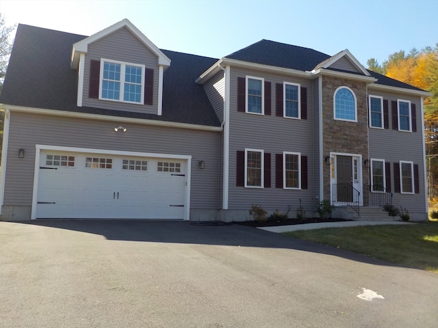 colonial home with a garage