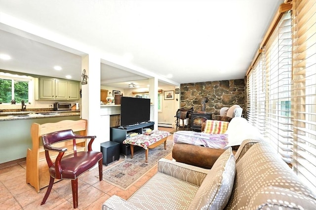 23 Westboro Rd, Upton, MA 01568 - living area with a wood stove, baseboard heating, and recessed lighting