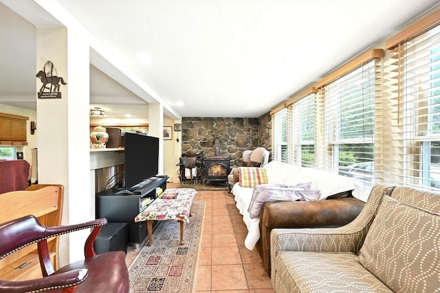 23 Westboro Rd, Upton, MA 01568 - living area featuring a wood stove, healthy amount of natural light, tile patterned floors, and recessed lighting