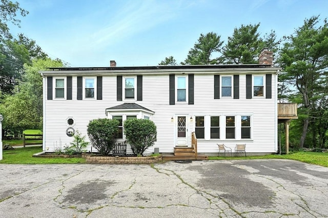 23 Westboro Rd, Upton, MA 01568 - colonial home with a chimney and entry steps