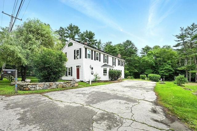 23 Westboro Rd, Upton, MA 01568 - colonial house with a chimney, driveway, and a front yard