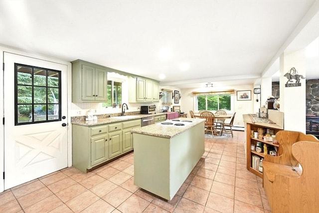 23 Westboro Rd, Upton, MA 01568 - kitchen with green cabinetry, stainless steel dishwasher, a center island, a baseboard radiator, and light tile patterned flooring
