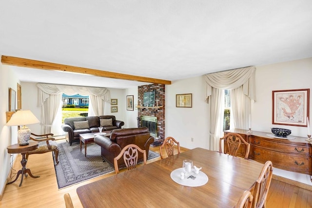 6 Boyd Dr, Newburyport, MA 01950 - dining space featuring light wood finished floors, a brick fireplace, and beam ceiling