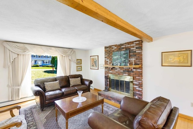 6 Boyd Dr, Newburyport, MA 01950 - living area featuring beam ceiling, a fireplace, wood finished floors, and baseboard heating