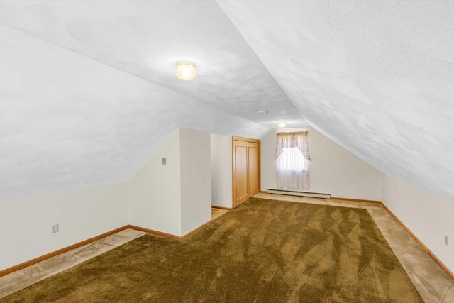6 Boyd Dr, Newburyport, MA 01950 - additional living space with vaulted ceiling, a baseboard heating unit, carpet, and a textured ceiling