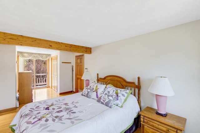 6 Boyd Dr, Newburyport, MA 01950 - bedroom with light wood-type flooring, beamed ceiling, and access to outside