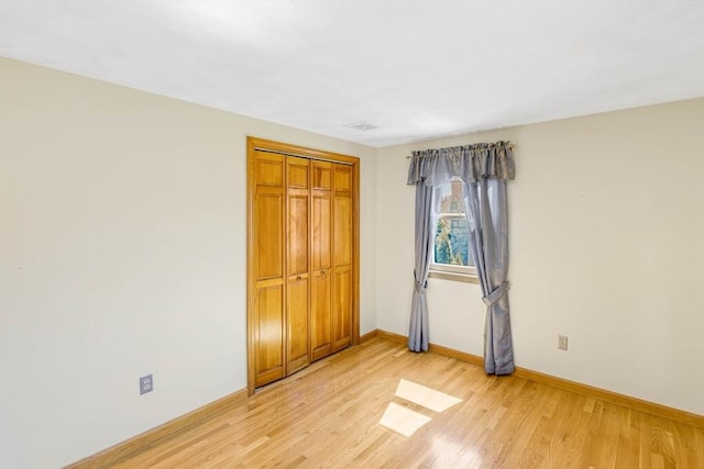 6 Boyd Dr, Newburyport, MA 01950 - unfurnished bedroom featuring light wood-style flooring and a closet