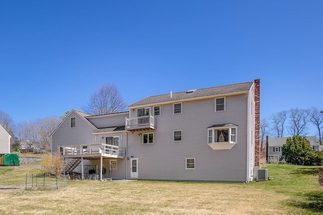 6 Boyd Dr, Newburyport, MA 01950 - rear view of house featuring a lawn, a chimney, a deck, and stairs