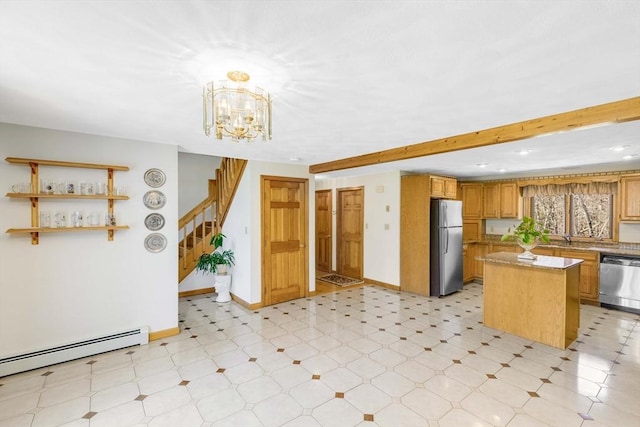 6 Boyd Dr, Newburyport, MA 01950 - kitchen with stainless steel appliances, baseboard heating, a kitchen island, a chandelier, and light stone countertops
