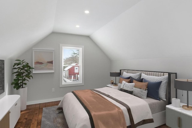 bedroom with dark wood-type flooring and lofted ceiling