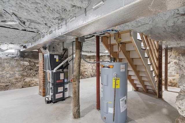 basement featuring heating unit and water heater