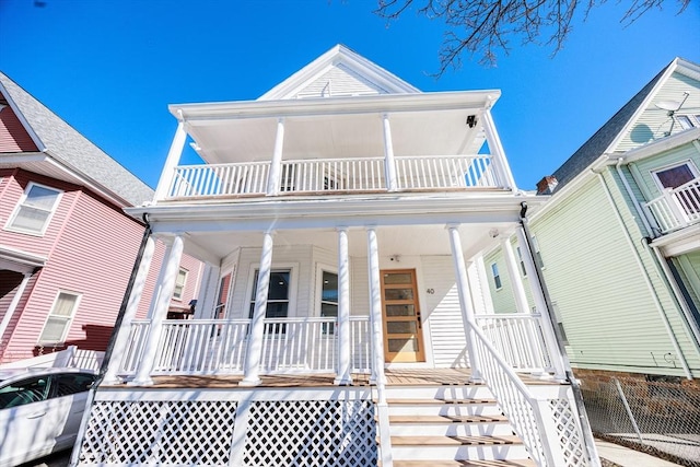 view of front of home featuring a porch and a balcony