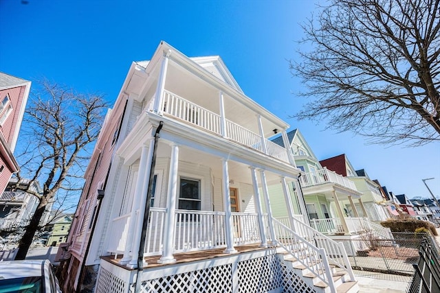 view of front of home with a residential view and a porch