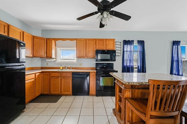 394 Huttleston Ave, Fairhaven, MA 02719 - kitchen featuring black appliances, open shelves, light tile patterned floors, ceiling fan, and brown cabinets