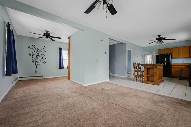 394 Huttleston Ave, Fairhaven, MA 02719 - living area with a baseboard radiator, ceiling fan, and light carpet