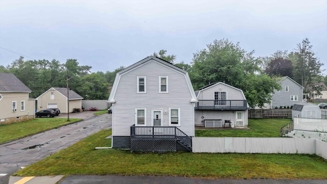394 Huttleston Ave, Fairhaven, MA 02719 - back of property with a gambrel roof, a balcony, and an outdoor structure