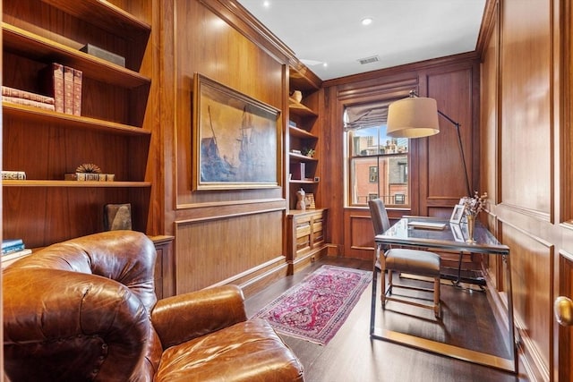 128 Marlborough St Unit 6, Boston, MA 02116 - home office with dark wood-style floors, wooden walls, built in features, and crown molding