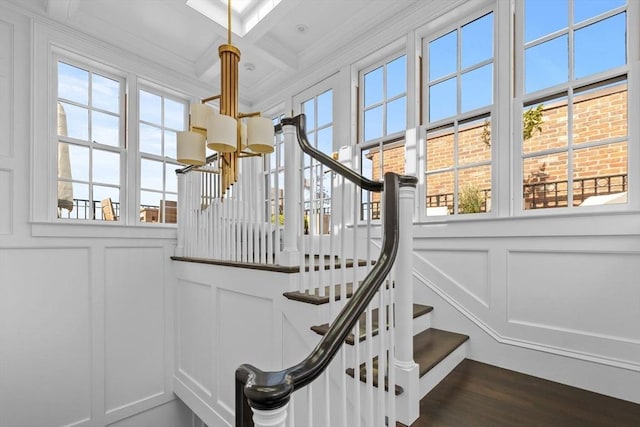 128 Marlborough St Unit 6, Boston, MA 02116 - stairway featuring a decorative wall, a chandelier, wood finished floors, coffered ceiling, and beam ceiling