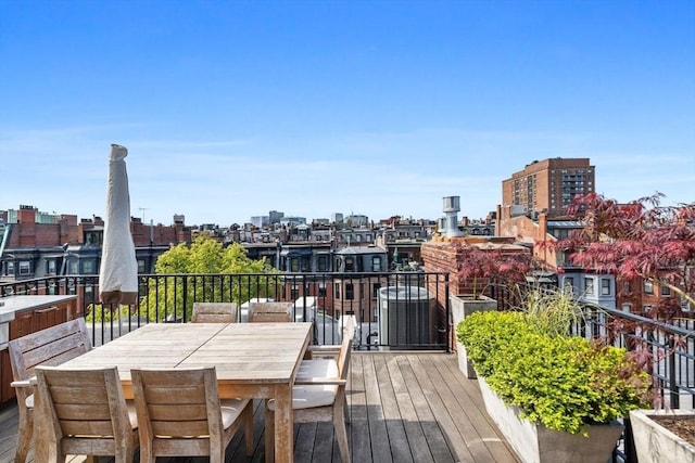 128 Marlborough St Unit 6, Boston, MA 02116 - wooden deck with a view of city and outdoor dining space