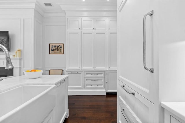 128 Marlborough St Unit 6, Boston, MA 02116 - interior space with a sink, crown molding, wood finished floors, and a decorative wall