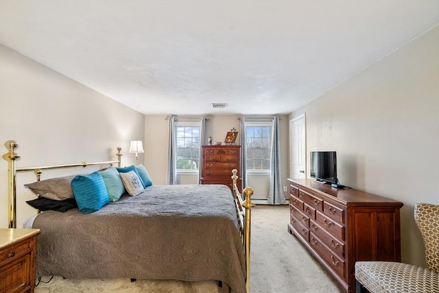 bedroom with light colored carpet