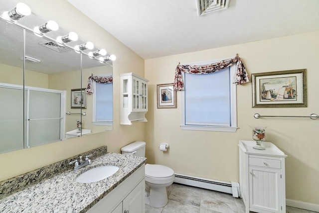 bathroom featuring vanity, a baseboard heating unit, an enclosed shower, and toilet